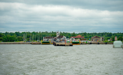 View of coastal port Kuivastu from ferry on the sea.