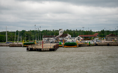 View of coastal port Kuivastu from ferry on the sea.