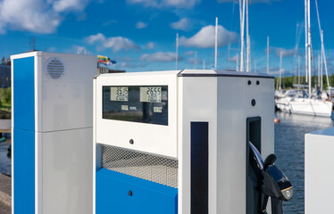 Boat fuel station with gasoline and diesel pumps.