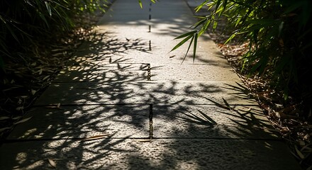 Sunlight filters through bamboo leaves, casting intricate shadows on a stone walkway, creating a tranquil and inviting path