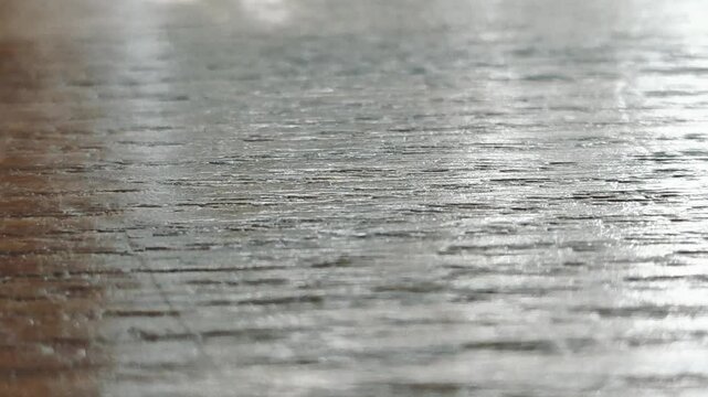 Old wooden tabletop with dramatic lighting and texture.