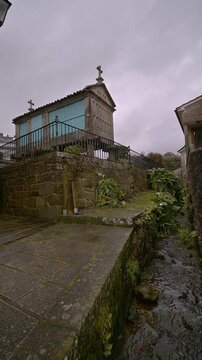 Combarro horreo overlooking a stream in galicia, vertical video