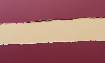 Torn paper layers with maroon top and bottom revealing a beige background in the center. Minimalist ripped design perfect for banners, creative layouts, scrapbooking, and visual composition mockups.