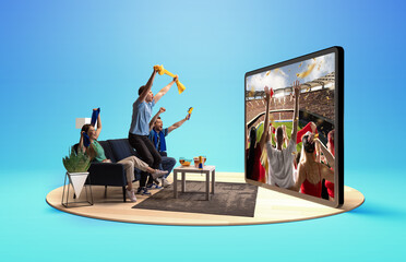 Fans cheer as a virtual stadium experience comes to life through a large digital screen at home....