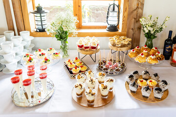 Dessert buffet or candy bar during catering event, fruits and whipped cream