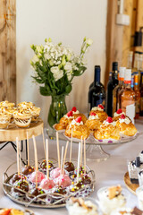 Dessert buffet or candy bar during catering event, fruits and whipped cream