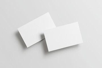 Blank business cards mock up on a light gray background, showcasing a minimalist design with ample copy space for customization and branding opportunities