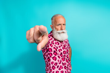 Photo of funny aged man point finger you wear leopard print outfit isolated on teal color background