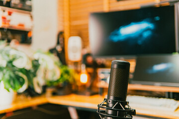 Modern cinematic desk setup with triple monitor, gaming chair, ambient light, and cozy atmosphere for work or gaming.