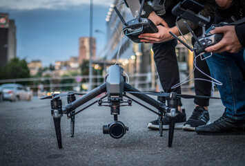 Drone lands on the street flying around city
