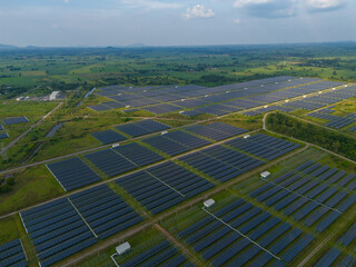An aerial view of a solar power plant, also known as a solar park, is a large-scale photovoltaic (PV) system designed to supply commercial electricity to the grid.	