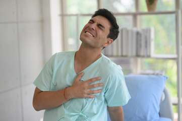 Patient is suffering from heart pain in the ward.