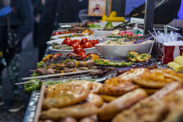 Street food meat vegetables salads on the counter