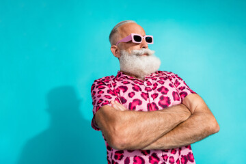 Photo of cool retired bearded male crossed hands look empty space wear trendy pink leopard print...