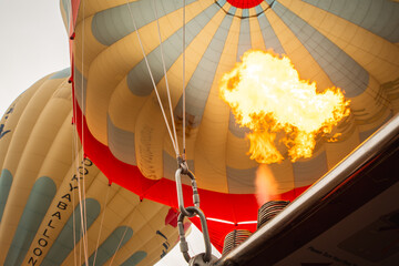 Goreme, Turkey - 27th december, 2024: inflating a hot air balloon by heating air with fire