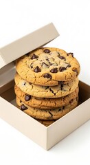 Delicious chocolate chip cookies are stacked within a partially open box on a plain backdrop