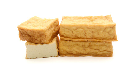 Smoked tofu cubes in wooden bowl
