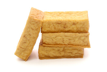 Smoked tofu cubes in wooden bowl