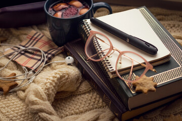 Object photography. On the windowsill lie book, Notepad, pen, glasses case, cookies, termoz and mug...