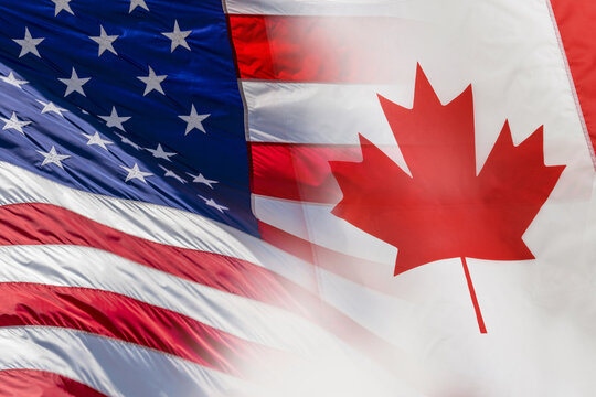 American and Canadian flags super-imposed over one another