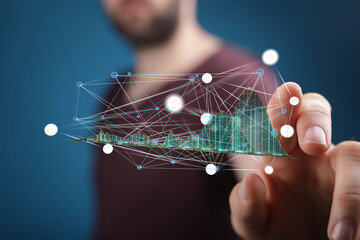 Close-up of a person interacting with a holographic representation of a data network and graph.