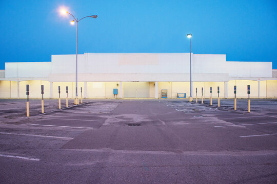 Exterior of abandoned retail store at dusk