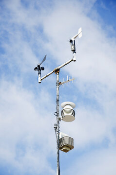 Weather monitoring station instruments against sky