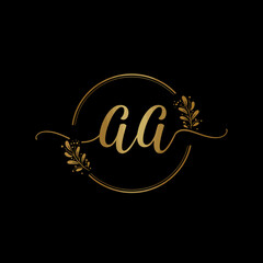 A luxurious golden 'aa' monogram logo, featuring elegant script letters encircled by delicate botanical flourishes on a sleek black background, perfect for premium branding.