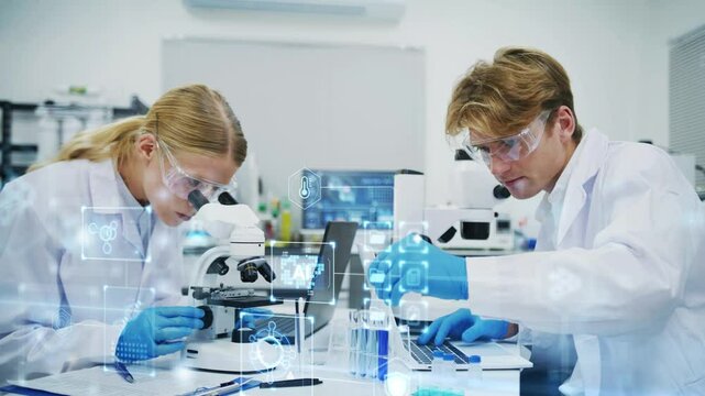 A researcher in a lab uses a microscope, takes notes, and integrates advanced AI technology to support innovative scientific research.