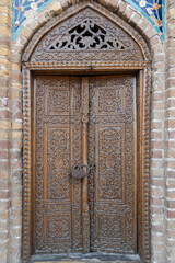 A decorative door with a lock on it at the Gur Amir Mausoleum in Samarkand, Uzbekistan