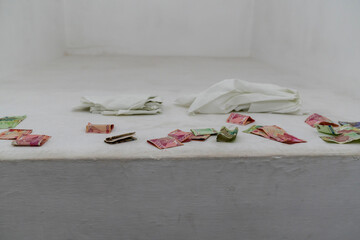 Banknotes left as wishes at the Shah-i-Zinda mausoleum, Samarkand, Uzbekistan.