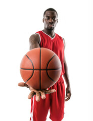 Basketball player in red uniform holding a basketball close to the camera for an exaggerated, dynamic visual effect in the foreground