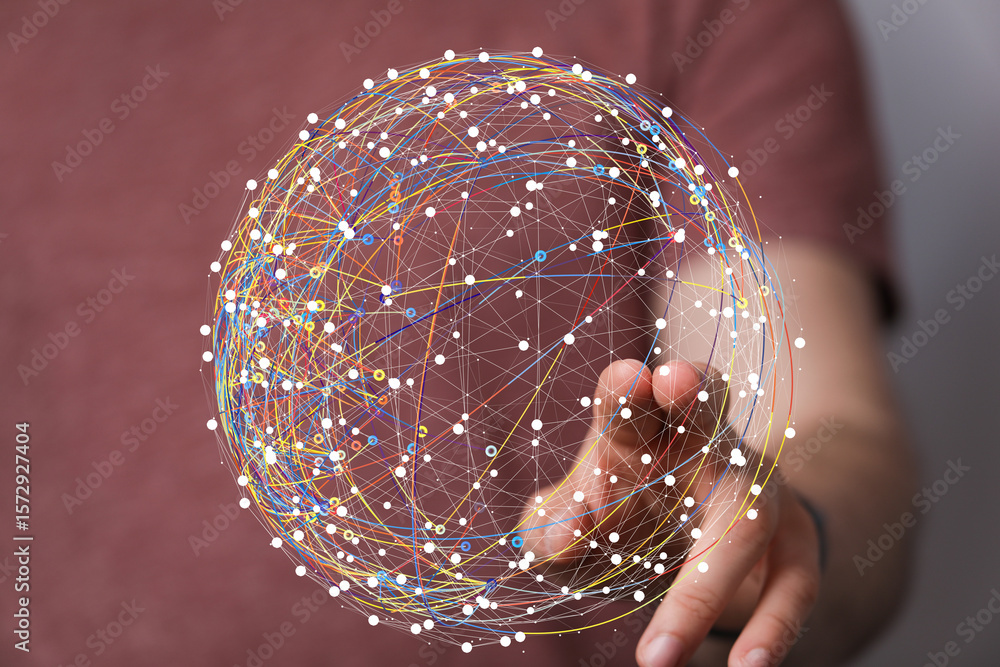 Poster abstract image of a hand interacting with a digital sphere representing global network connections a