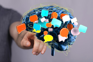 Conceptual image of a brain with colorful speech bubbles, representing communication, ideas, and networking.