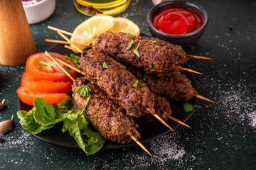 Shish kebab on stick, made from ground beef meat. Lula kebab, traditional Caucasian dish, with...