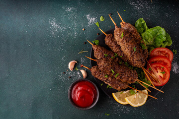 Shish kebab on stick, made from ground beef meat. Lula kebab, traditional Caucasian dish, with...