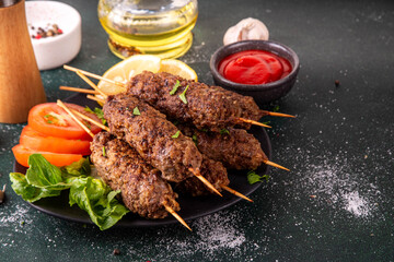 Shish kebab on stick, made from ground beef meat. Lula kebab, traditional Caucasian dish, with...