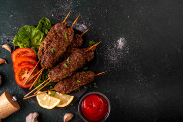 Shish kebab on stick, made from ground beef meat. Lula kebab, traditional Caucasian dish, with...