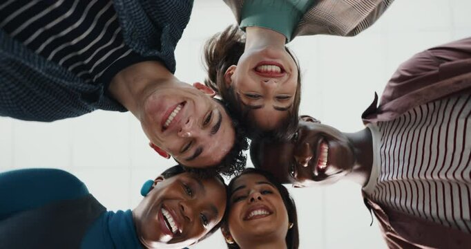 Face, low angle and business people huddle for team building with 360, diversity or connection. Happy group, portrait and circle below with workers for support, synergy or community in startup office
