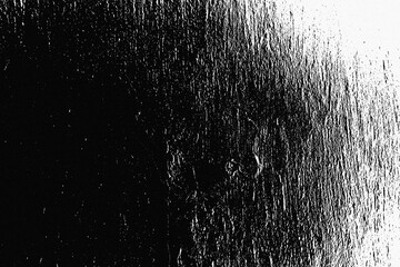 Destroyed black and white crumbled plaster on aged painted brushed surface. Rough grunge chipped edges of worn block. Old messy rustic peeling stone. Dust Overlay Distress Grainy Grungy Effect.