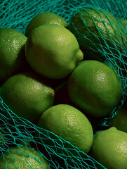 Vibrant Green Limes in Eco-Friendly Netting: Fresh Organic Citrus Texture and Colorful Culinary Decor