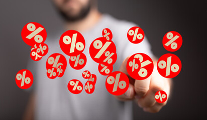 Image depicting a man interacting with floating percentage symbols, perfect for discount, sale, or...