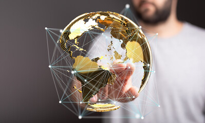 Person interacting with a digital globe, representing global network and connection technology.