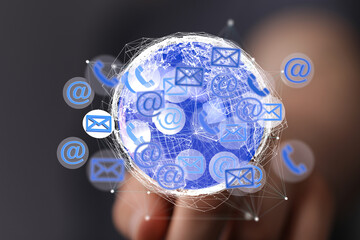 Image of a digital globe with email, phone, and internet icons, representing global communication.