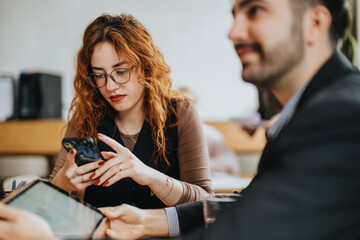 People interact during a business meeting in a warm co working space, featuring casual discussions...