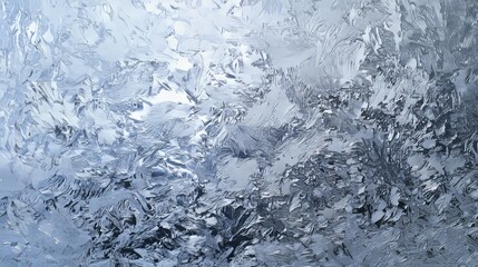 Fototapeta premium Frozen cracked ice texture with natural frosty patterns in blue tones. Abstract winter background perfect for seasonal designs, banners, wallpapers, packaging, or digital presentations