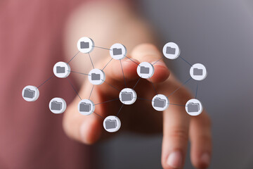 Hand interacting with digital files network. Data sharing, cloud storage concept.