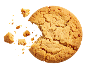 A round, golden-brown cookie with a bite taken out, surrounded by scattered crumbs.