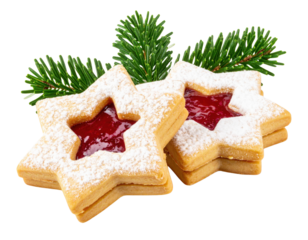 Star-shaped cookies filled with red jam and dusted with powdered sugar, accompanied by green pine branches.