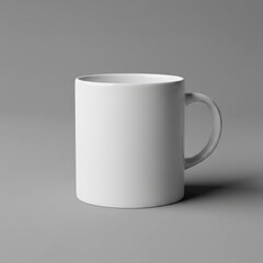 Fototapeta premium A simple white ceramic mug is placed on a flat surface, photographed against a plain background. The mug has a clean, minimal design with a rounded handle on the right side.